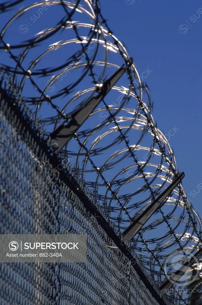 Low angle view of a barbed wire fence
