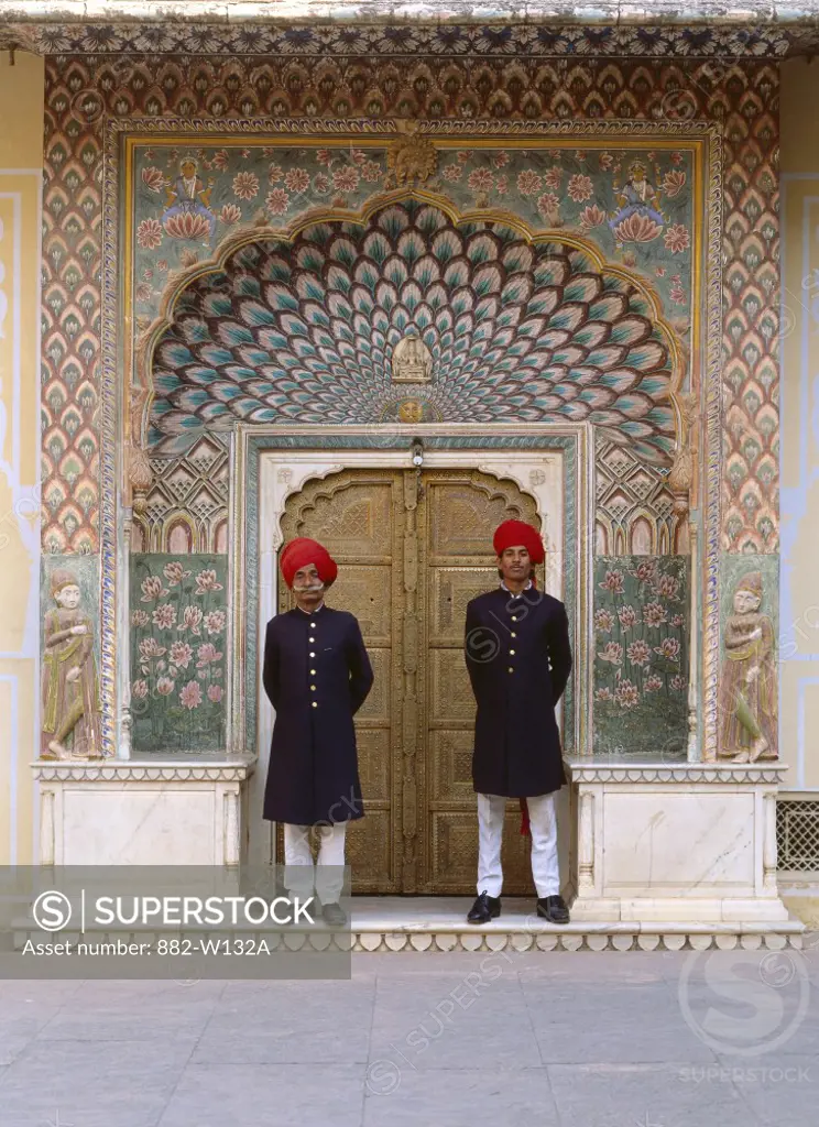 Two security guards standing at the door of a palace, City Palace, Jaipur, Rajasthan, India