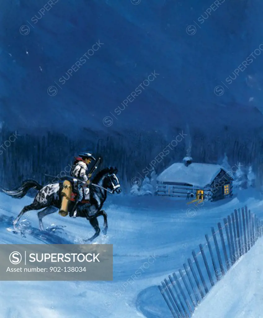 Cowboy riding a horse in snow
