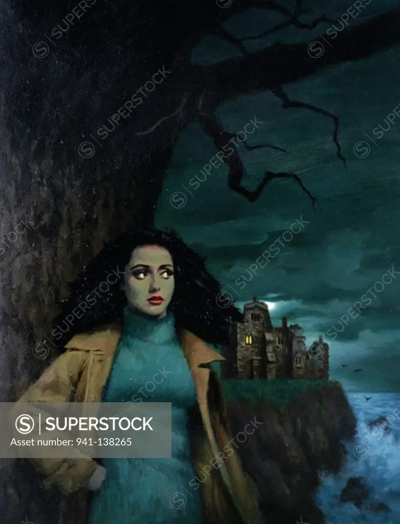 Woman standing on the coast with a castle in the background