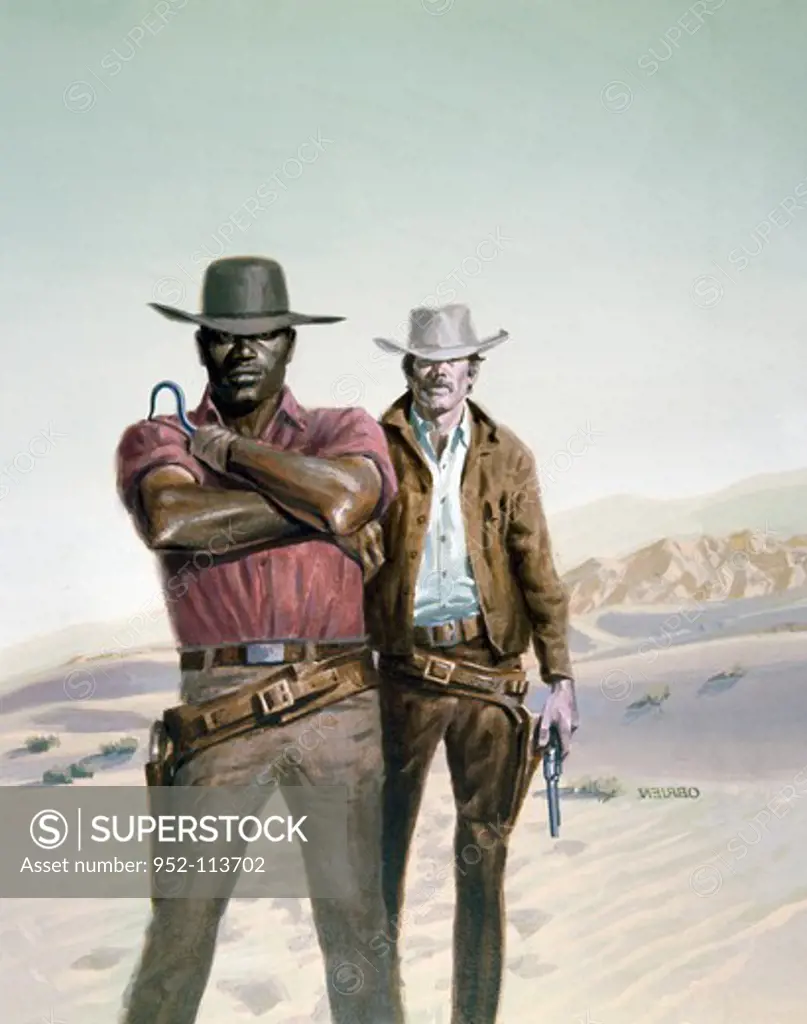 Cowboys standing in a desert
