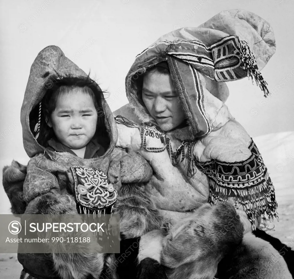 Mid adult Eskimo woman with her daughter