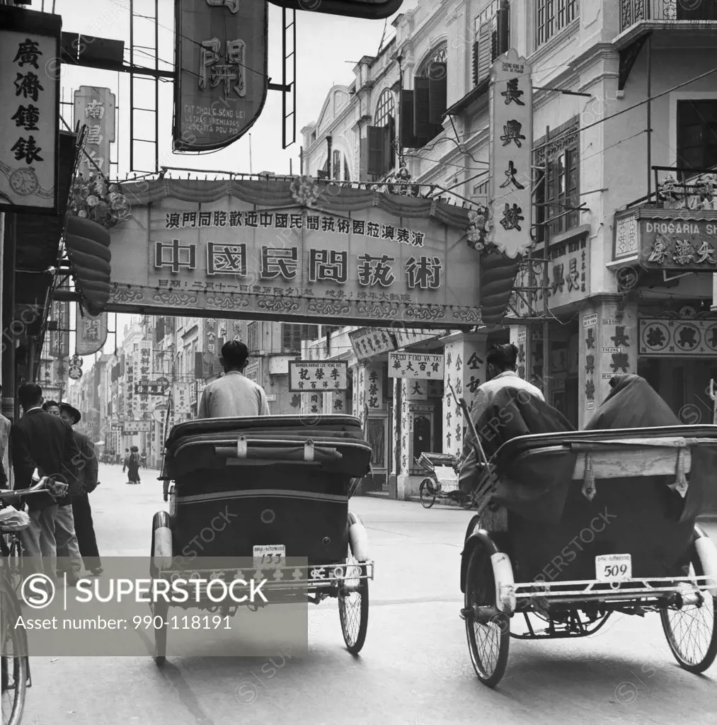 Pedicabs in a market street, Avenida de Almeida Ribeiro, Macao, China