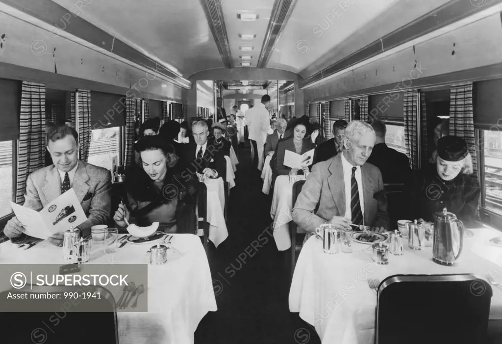 Men and women on a train, Pennsylvania Railroad Congressional