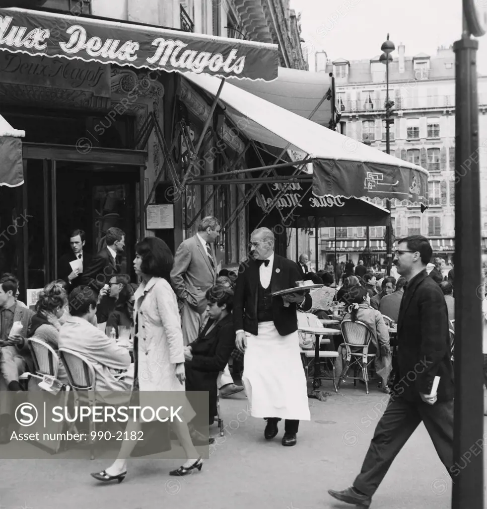 Group of people sitting in a sidewalk cafe, Aux Deux Magots, Paris, France