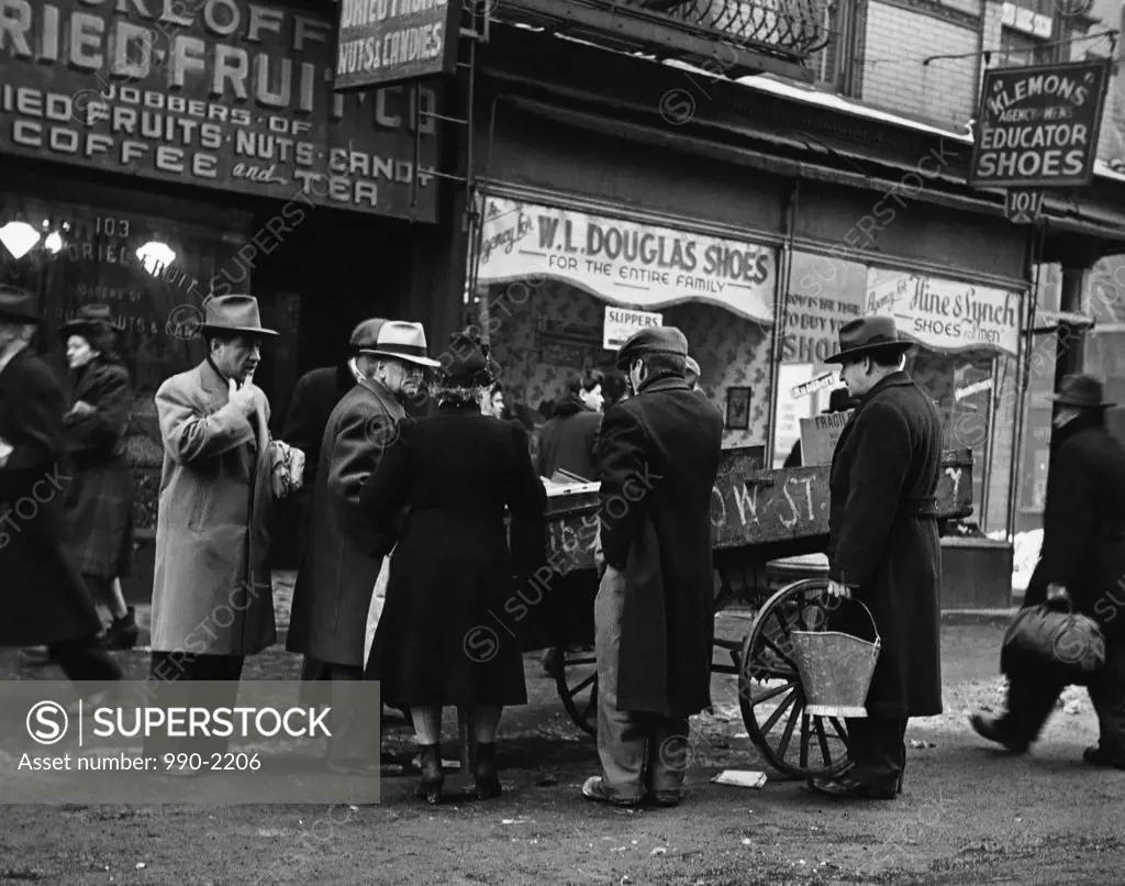 Group of people near a street vendor, New York City, New York, USA