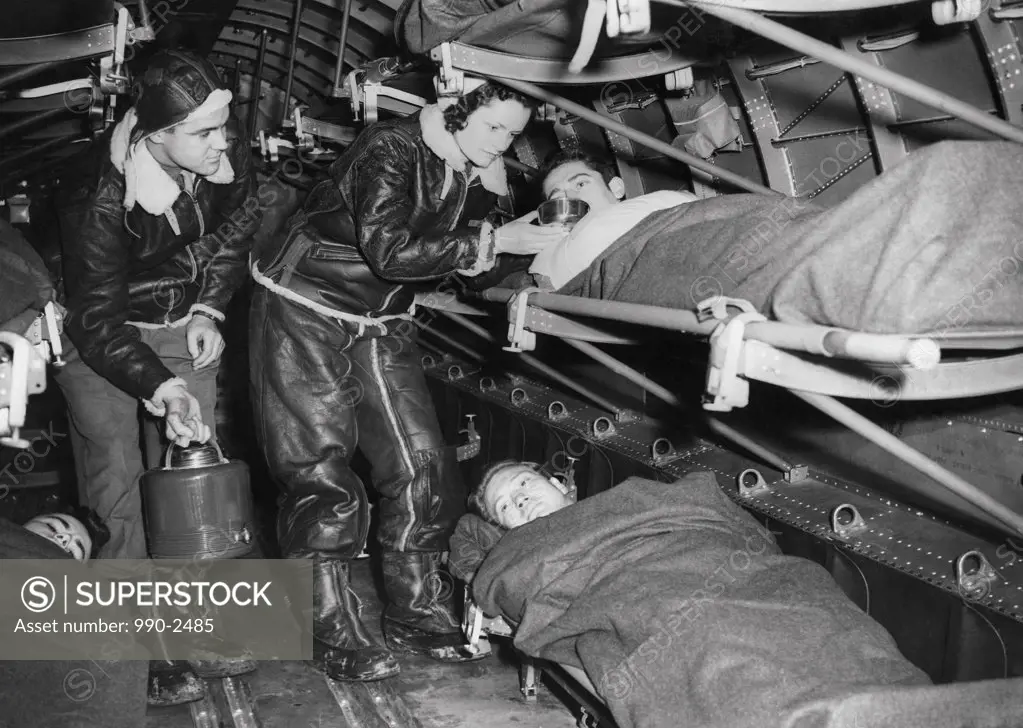 Female nurses examining victims, Great Britain, 1943