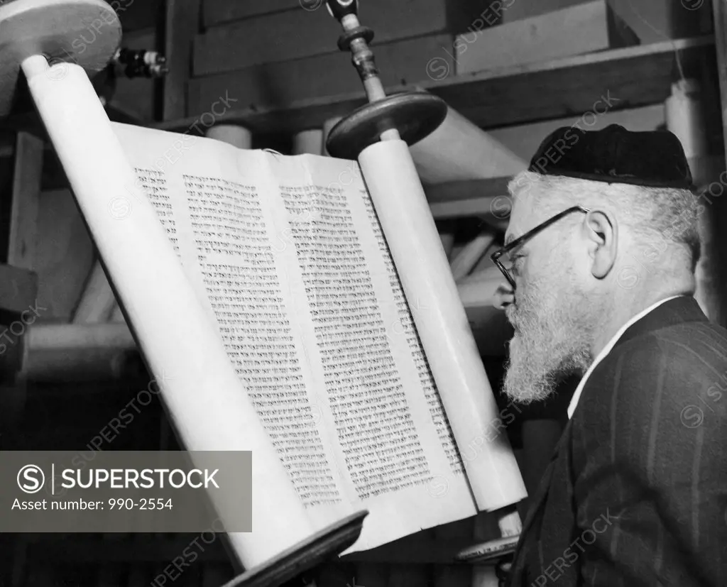 Torah scribe reading the torah