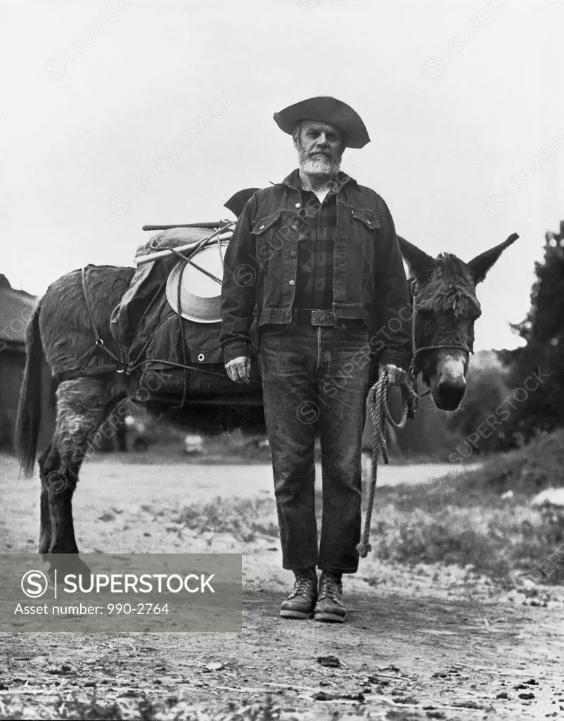 Portrait of a miner with his donkey