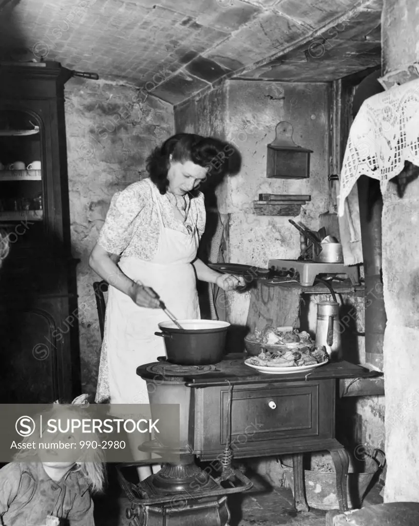 Mid adult woman cooking