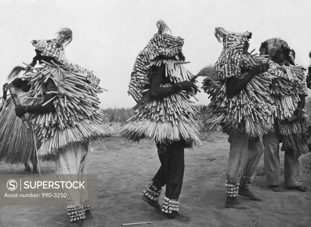 Native dancers wearing costumes and dancing, Benin