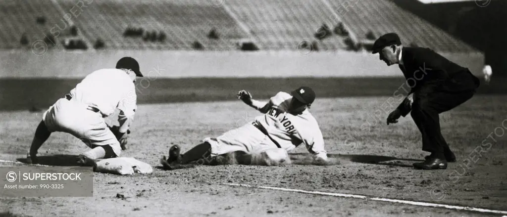 Baseball players playing baseball in a stadium