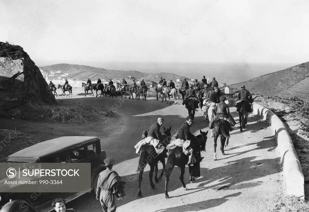 High angle view of a group of people horseback riding during a war, Spanish Civil War