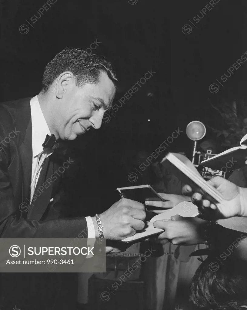 Actor Jack Webb signing autographs