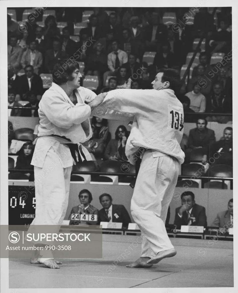 Two judokas participating in a judo competition