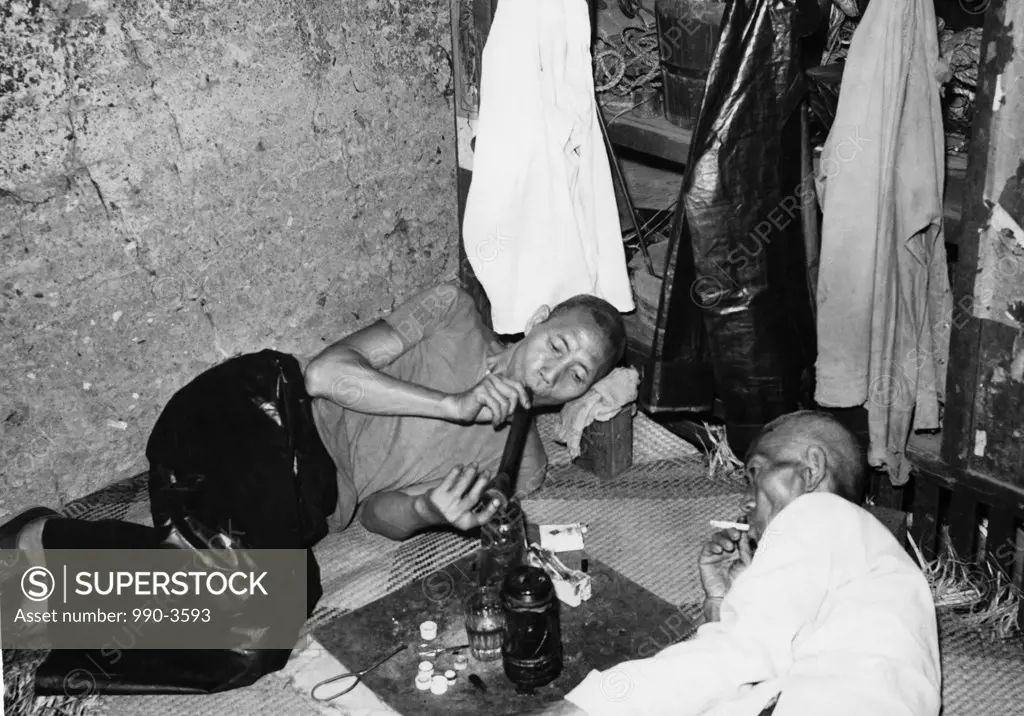 China, Hong Kong, High angle view of two mature men smoking opium