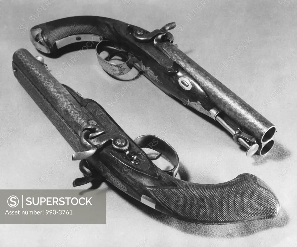 Close-up of two antique handguns
