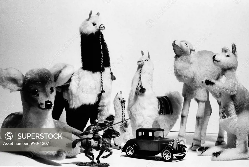 Close-up of a group of stuffed toys with a toy car