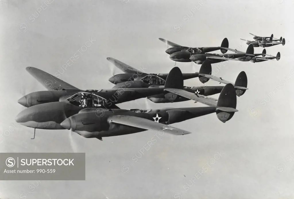 Four fighter planes in flight, P-38 Lightning