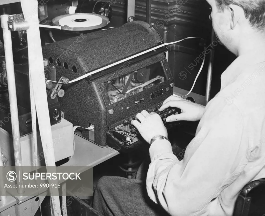 Transcribing operator typing in an office converting incoming Morse signals into teletype tape, RCA Communications, 1947